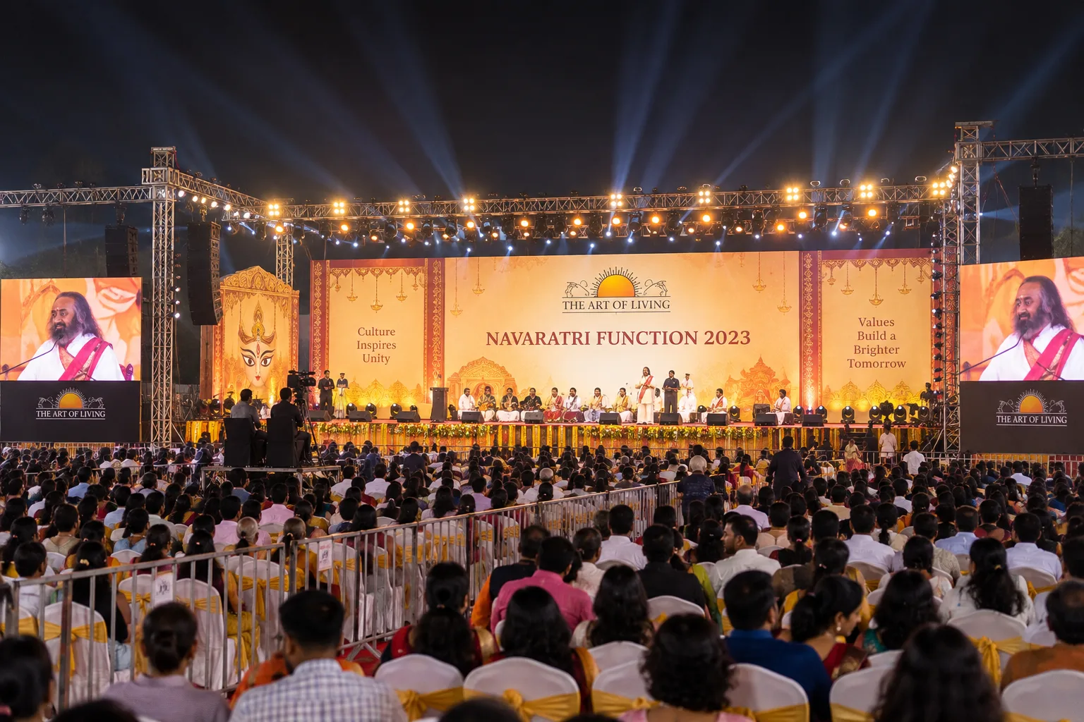 Row after row of seated participants across an immense covered gathering.